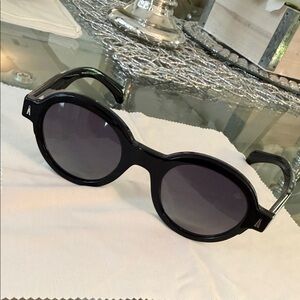 Montcler Rondosa women’s round sunglasses with case and cleaning cloth.